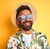 Happy man wearing sunglasses and a flowered shirt